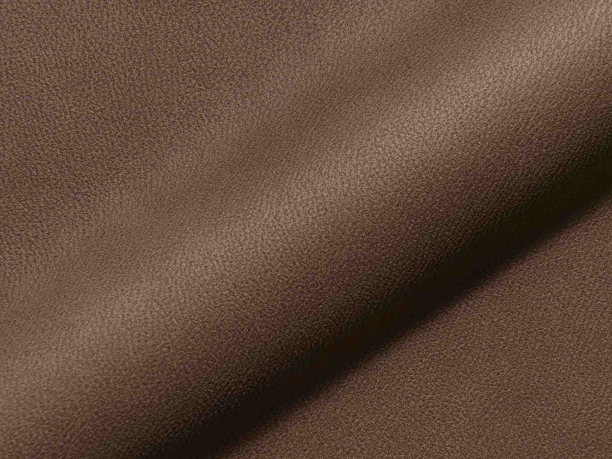 Polsterstoff Utori 1009 mit feiner Lederoptik und glatter Oberfläche, robust und pflegeleicht für moderne Polster.