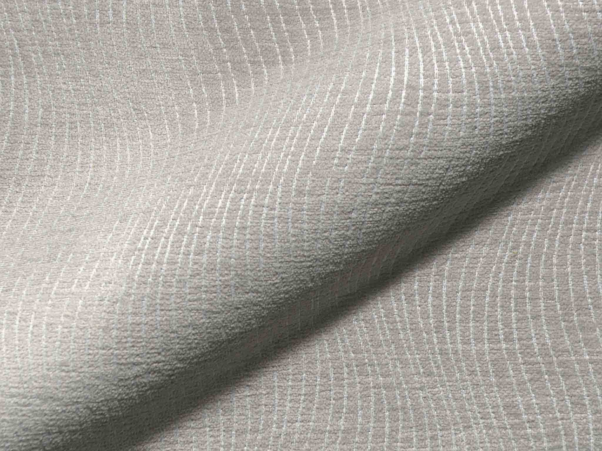 Nahaufnahme eines strukturierten Polsterstoffs mit gleichmäßigem Gewebe und ruhiger Oberfläche.